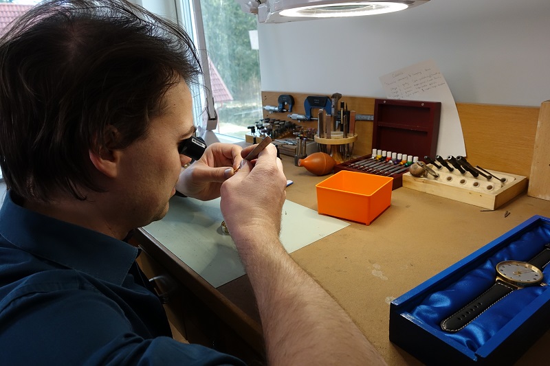 Behind the Scenes: Holme Finnilä, founder of Levenaig Watches inspecting manufactured parts.